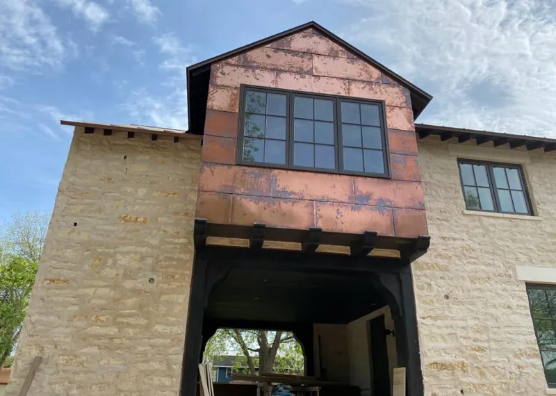 Copper metal panel facade on a stone building for Skylight Installation in Penn Hills