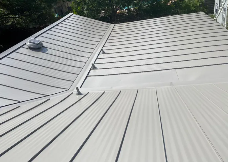 Solar attic fan installed on a metal roof for Roof Ventilation in Penn Hills